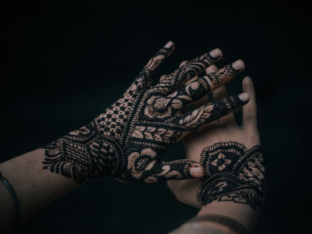 A woman's hand with Rajasthani Mehndi Design.